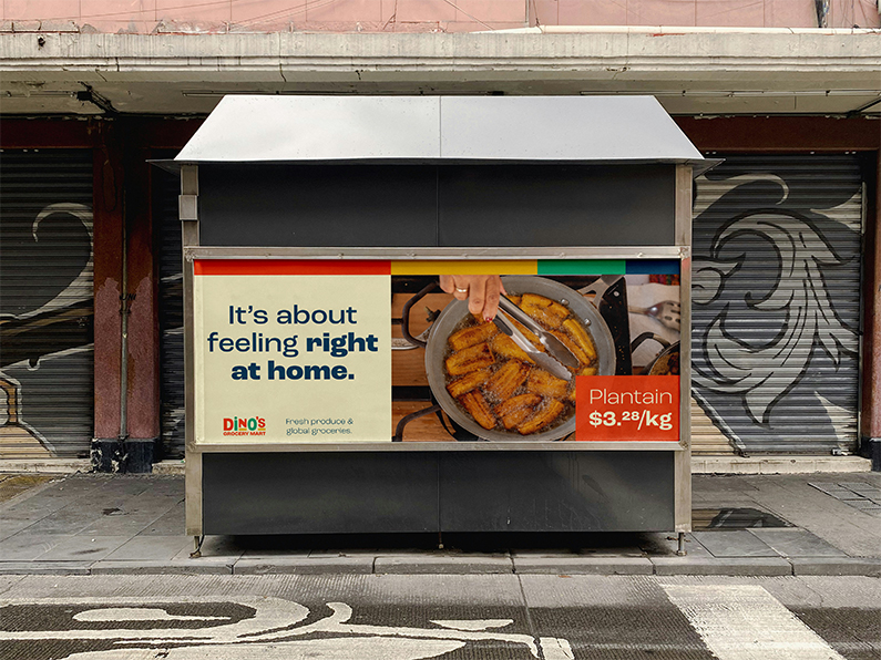 Bus shelter on a city street that's advertising Dinos Grocery Mart